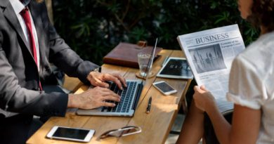 Modern journalist using multiple digital devices and platforms for news reporting