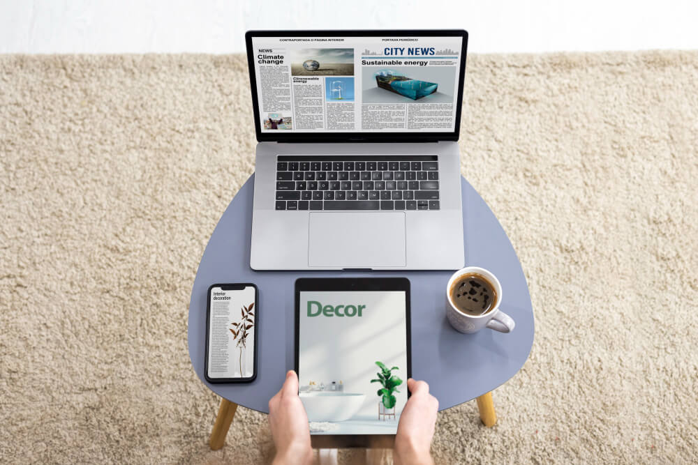 Multiple devices displaying news content across different platforms, including mobile, tablet, and desktop